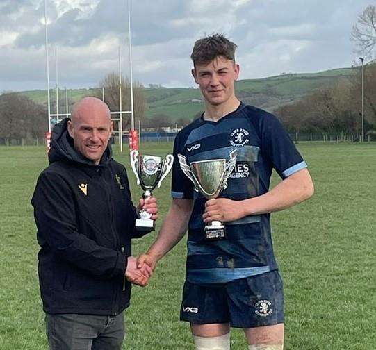 Aled Parry presents the trophy to Aber skipper Henri Michell Aled Parry presents the trophy to Aber skipper Henri Michell